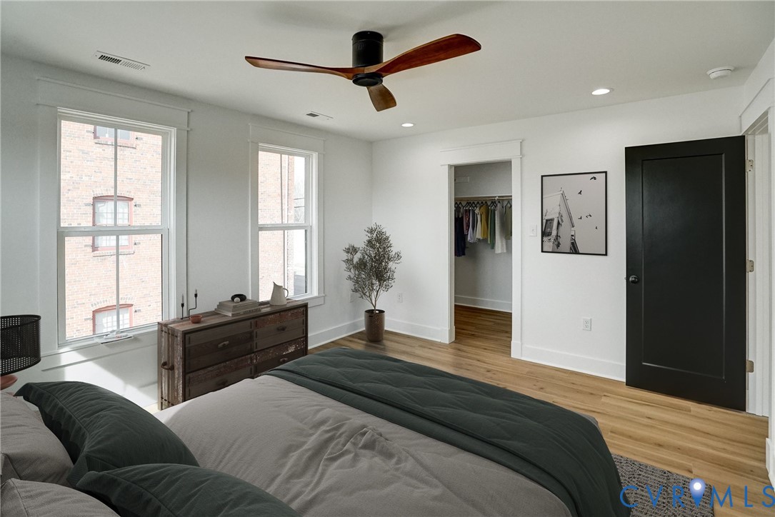 901 Commerce Street Petersburg, VA 23803 - Photo 29 of 40 a bedroom with a bed and a large window
