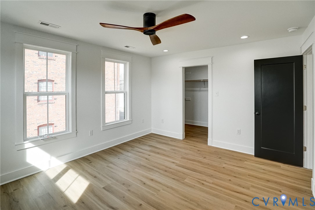 901 Commerce Street Petersburg, VA 23803 - Photo 30 of 40 a view of an empty room with wooden floor and a window