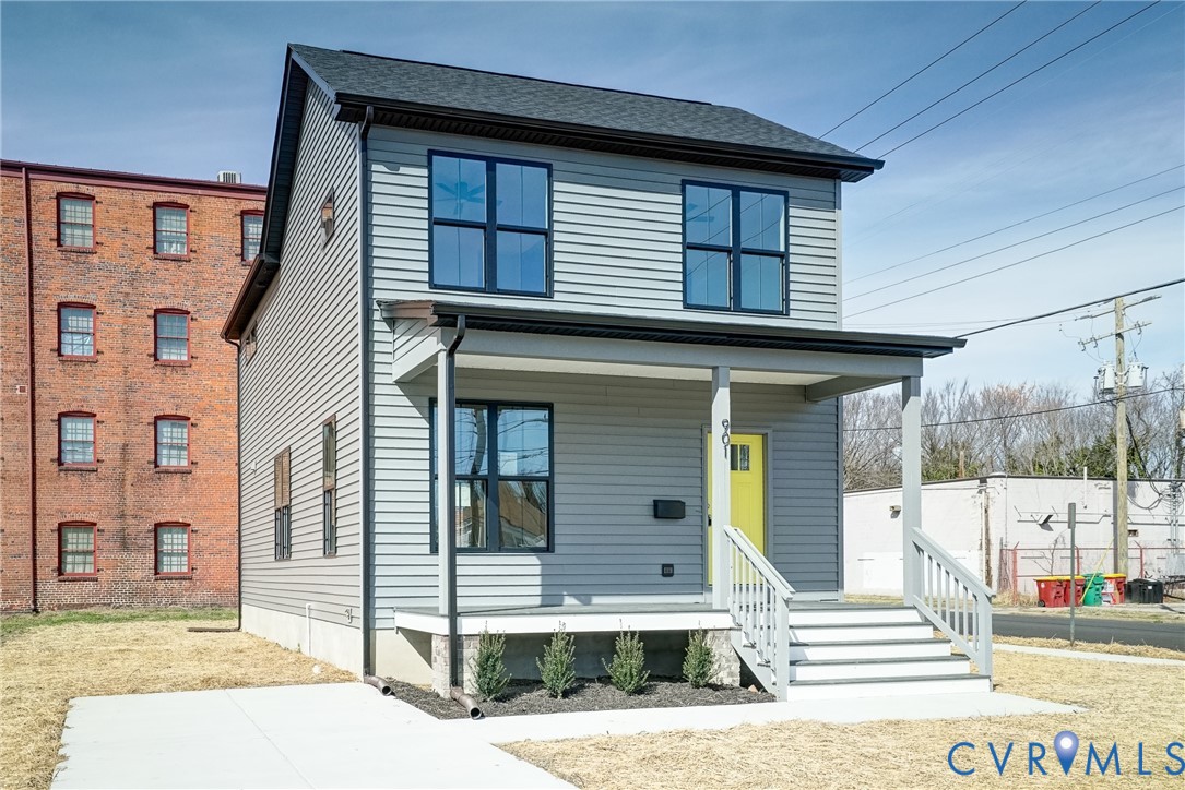 901 Commerce Street Petersburg, VA 23803 - Photo 3 of 40 a front view of a house with a garage