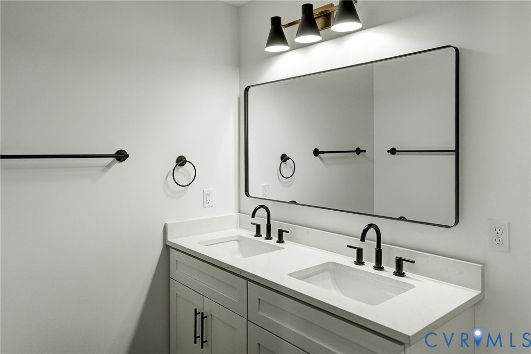 901 Commerce Street Petersburg, VA 23803 - Photo 32 of 40 a bathroom with a sink and a mirror