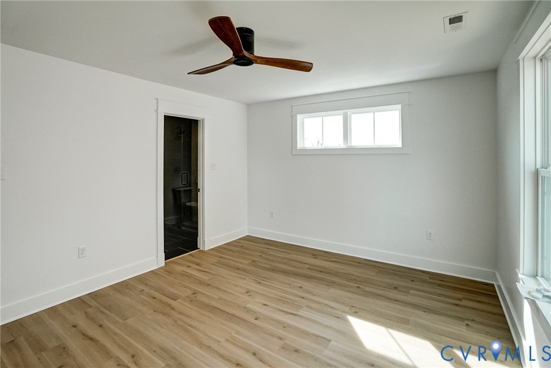 901 Commerce Street Petersburg, VA 23803 - Photo 35 of 40 a view of a big room with wooden floor and a window