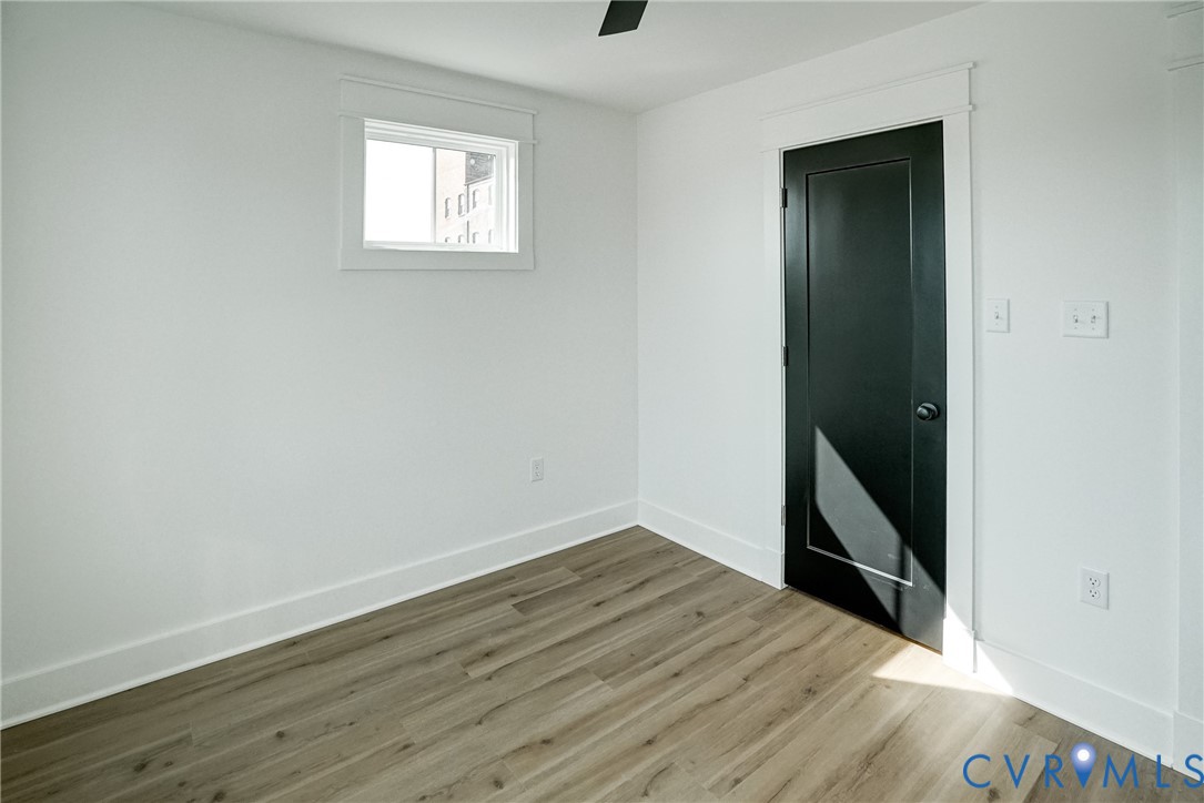 901 Commerce Street Petersburg, VA 23803 - Photo 39 of 40 an empty room with wooden floor and closet