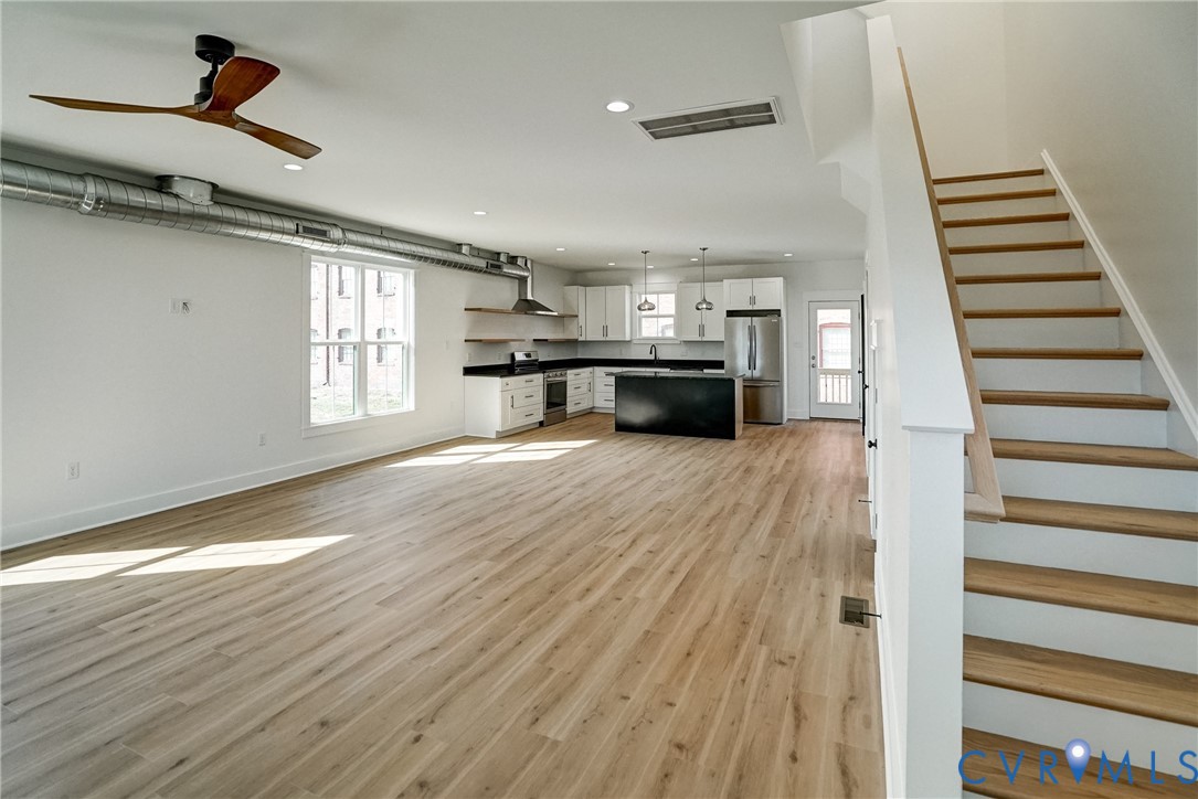 901 Commerce Street Petersburg, VA 23803 - Photo 6 of 40 a view of kitchen and hall with wooden floor