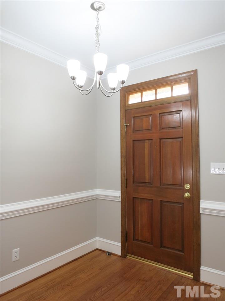 6820 Gloucester Road Raleigh, NC 27612 - Photo 2 of 25 a view of a room with rack on the wall