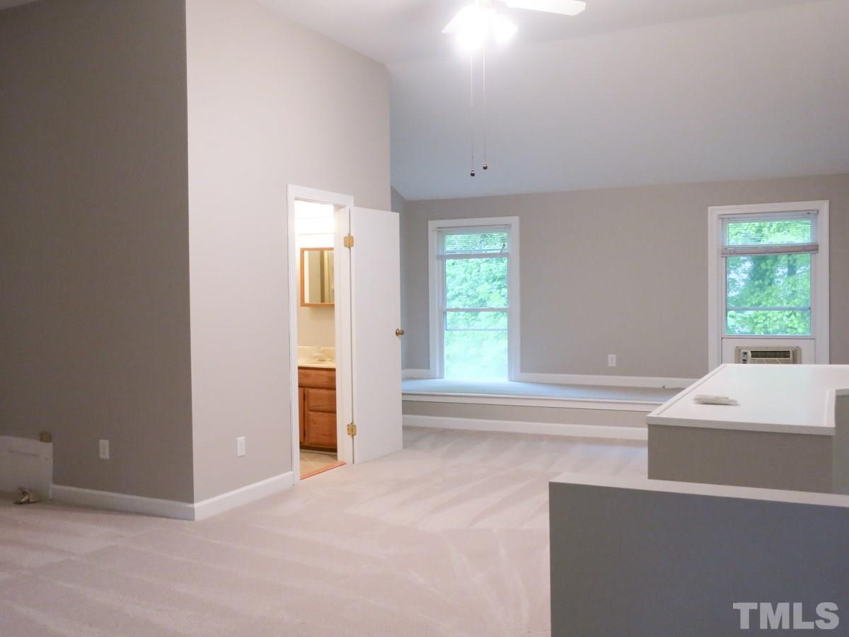 6820 Gloucester Road Raleigh, NC 27612 - Photo 17 of 25 a view of an empty room with a window