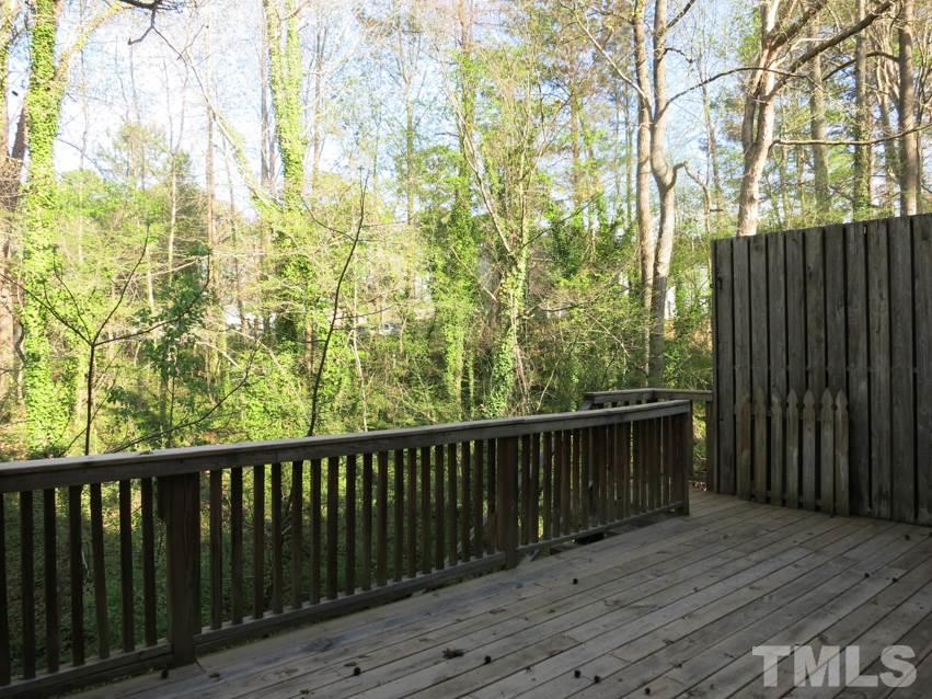 6820 Gloucester Road Raleigh, NC 27612 - Photo 22 of 25 a balcony with wooden floor and fence
