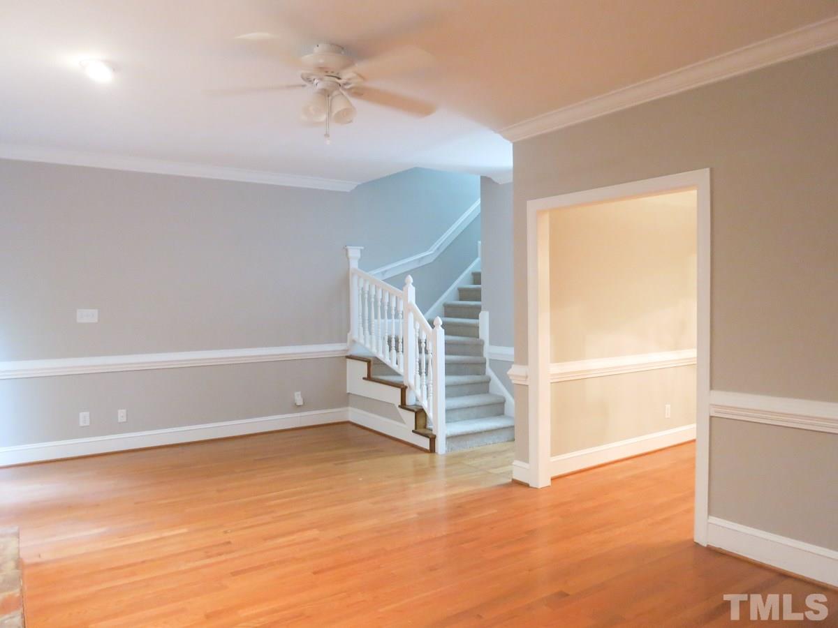 6820 Gloucester Road Raleigh, NC 27612 - Photo 5 of 25 an empty room with windows and pillars in it