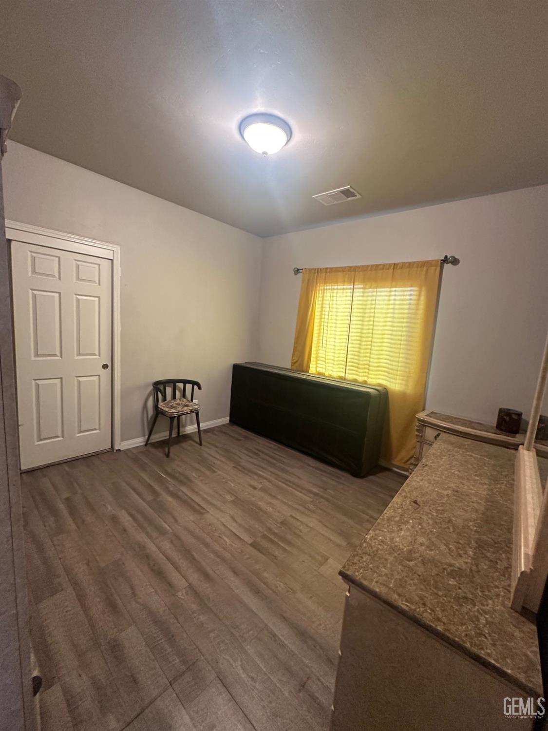 Undisclosed Address Wasco, CA 93280 - Photo 14 of 24 a bedroom with a bed and window