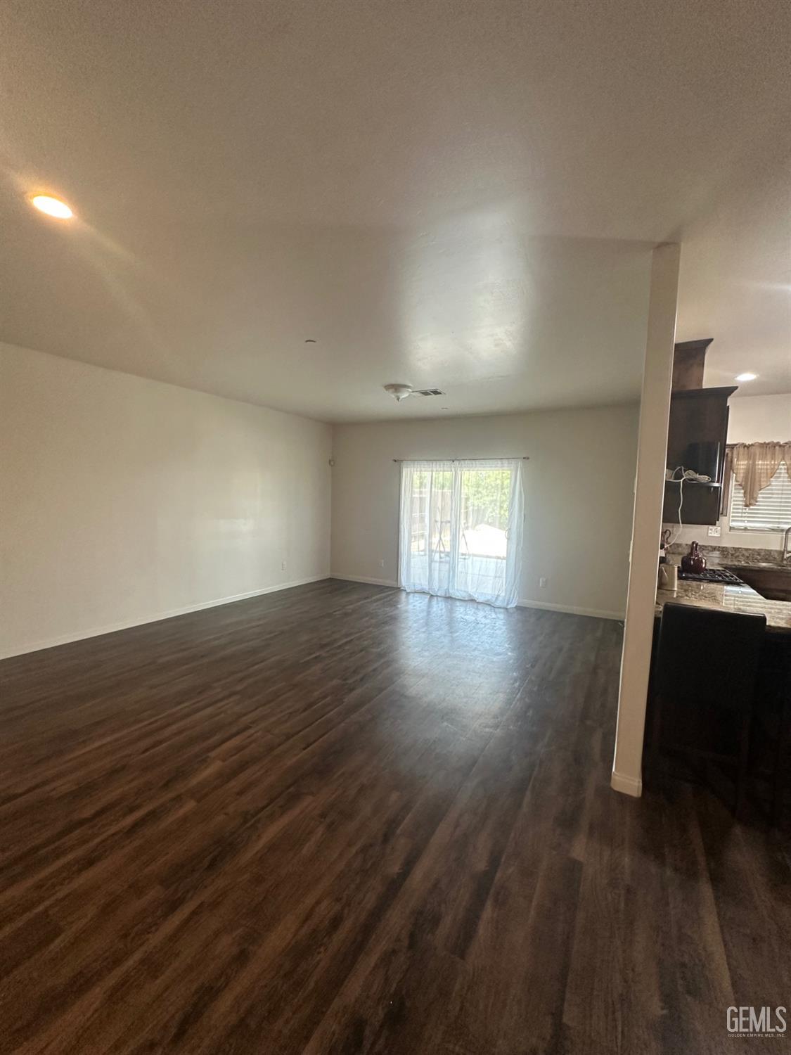 Undisclosed Address Wasco, CA 93280 - Photo 15 of 24 a view of empty room with wooden floor