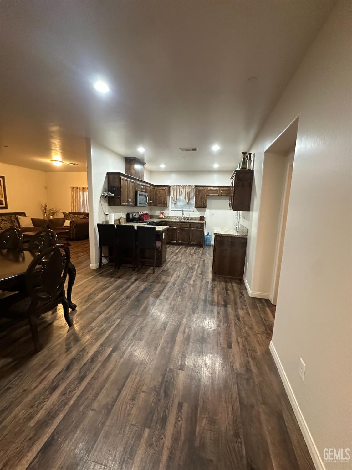 Undisclosed Address Wasco, CA 93280 - Photo 5 of 24 a living room with furniture and a wooden floor