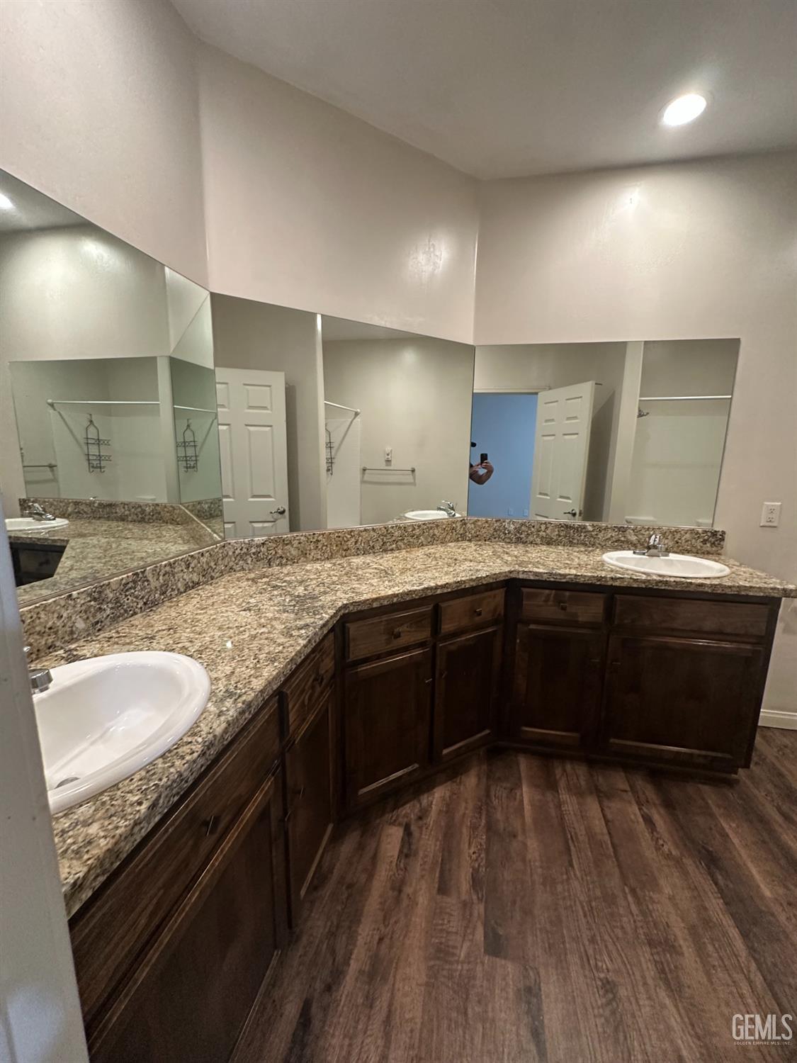 Undisclosed Address Wasco, CA 93280 - Photo 9 of 24 a spacious bathroom with a granite countertop sink and a mirror
