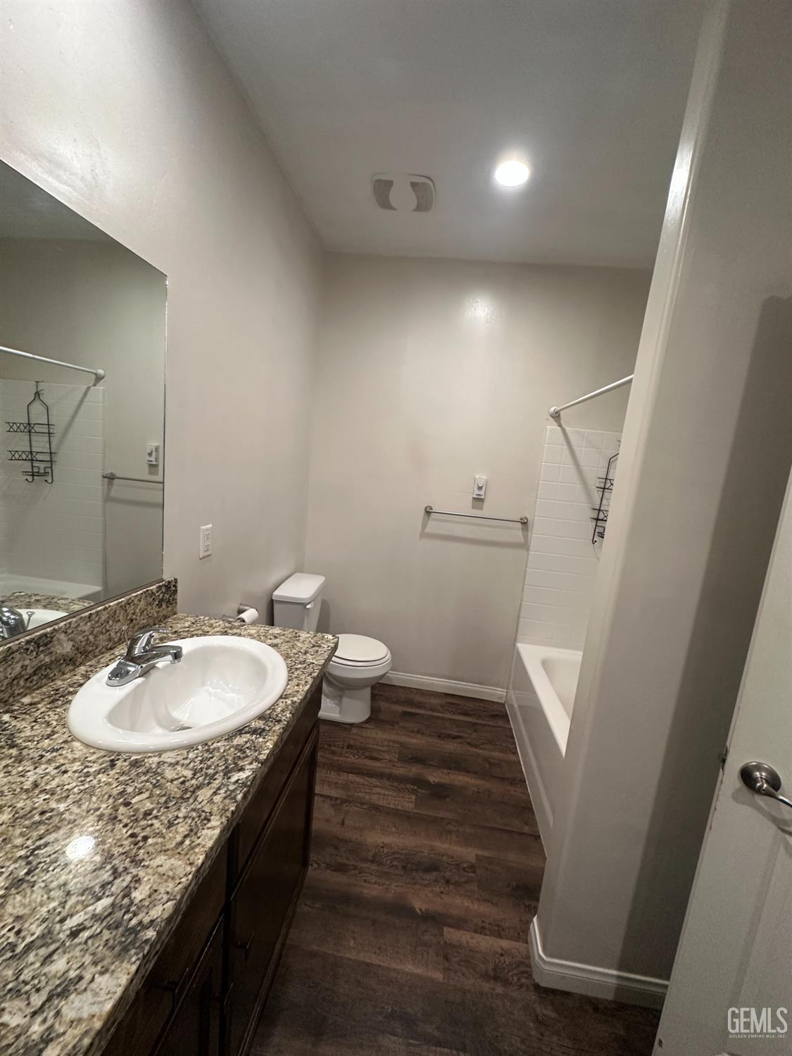 Undisclosed Address Wasco, CA 93280 - Photo 10 of 24 a bathroom with a granite countertop sink a mirror and a toilet