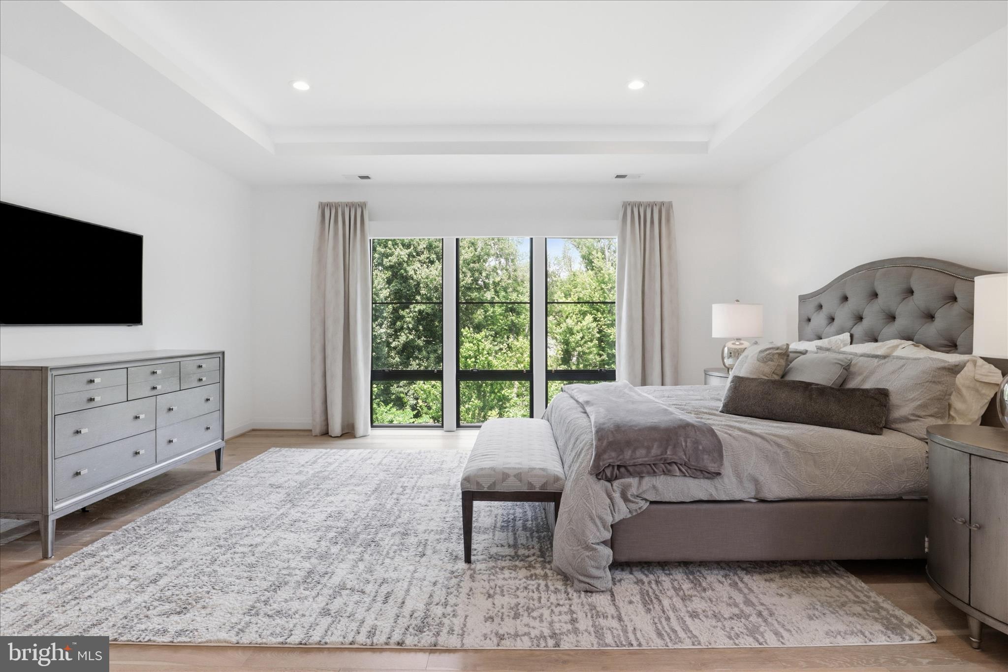 202 Branch Road Southeast Vienna, VA 22180 - Photo 18 of 59 a spacious bedroom with a bed and a flat screen tv