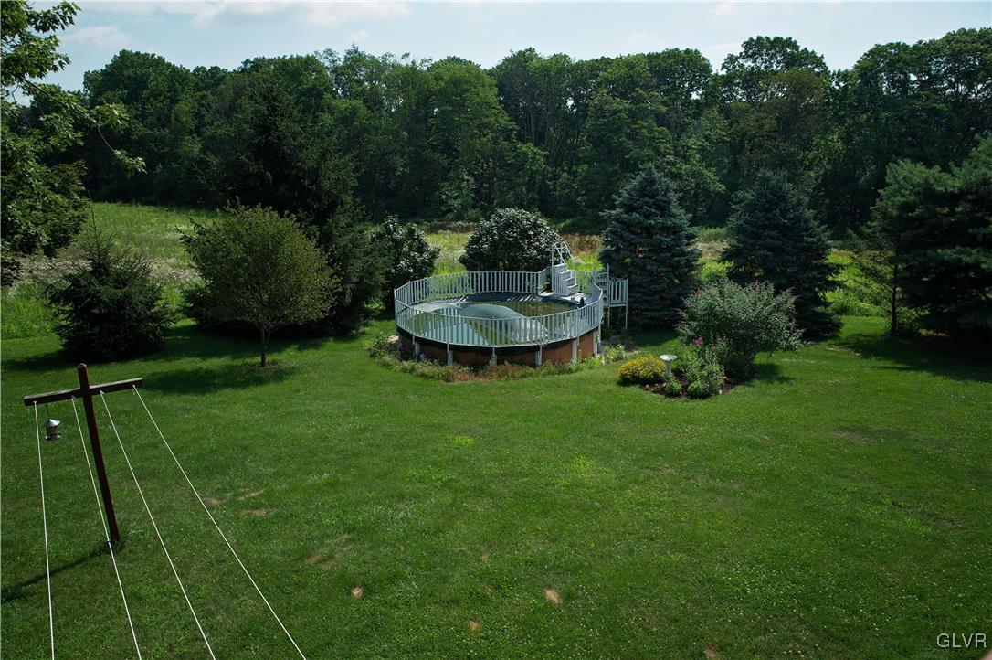 306 Deer Run Road Bechtelsville, PA 19505 - Photo 21 of 29 View of back yard and pool from deck