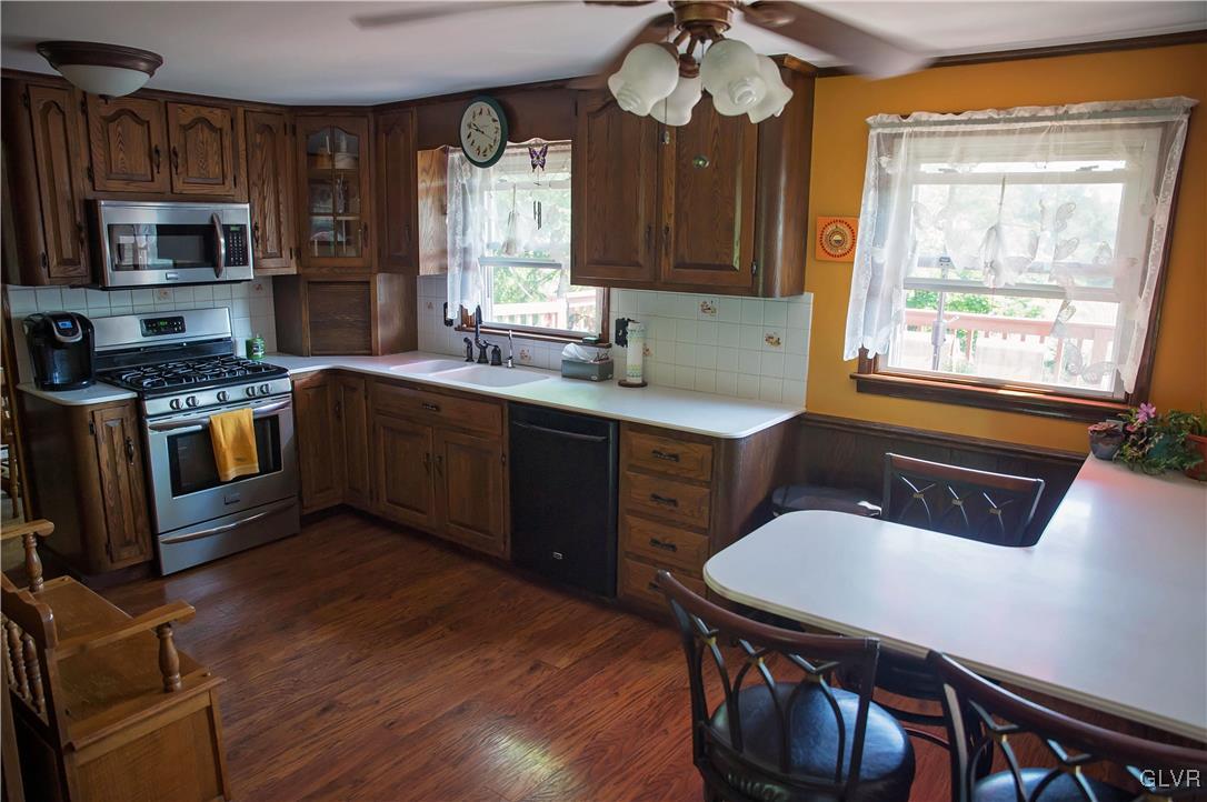 306 Deer Run Road Bechtelsville, PA 19505 - Photo 4 of 29 Kitchen with breakfast bar, gas stove/oven, wood f