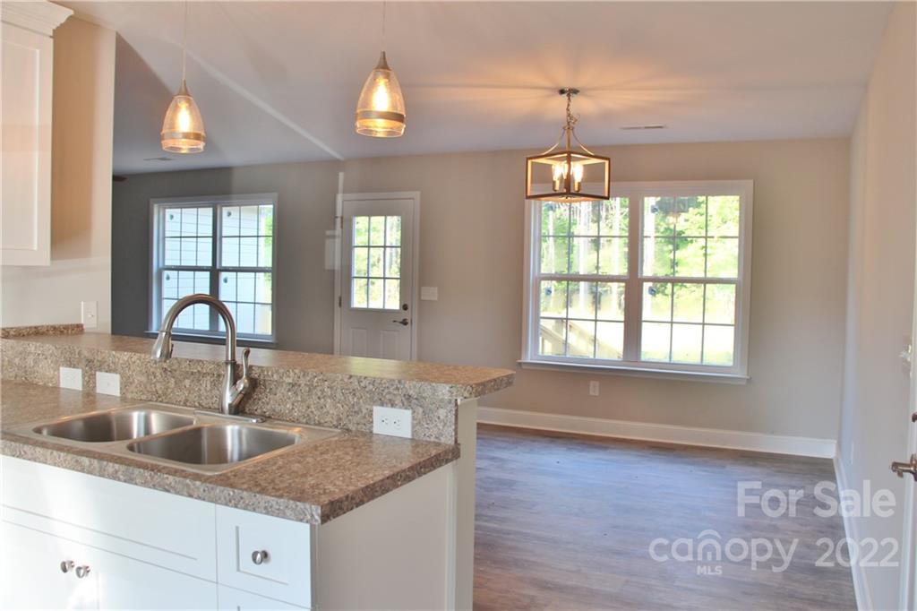 4256 Fletcher Funderburk Road Lancaster, SC 29720 - Photo 5 of 18 a kitchen with granite countertop a sink and a window