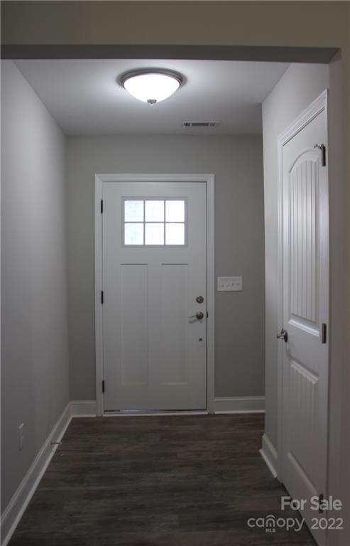 4256 Fletcher Funderburk Road Lancaster, SC 29720 - Photo 7 of 18 a view of an empty room with wooden floor and a window