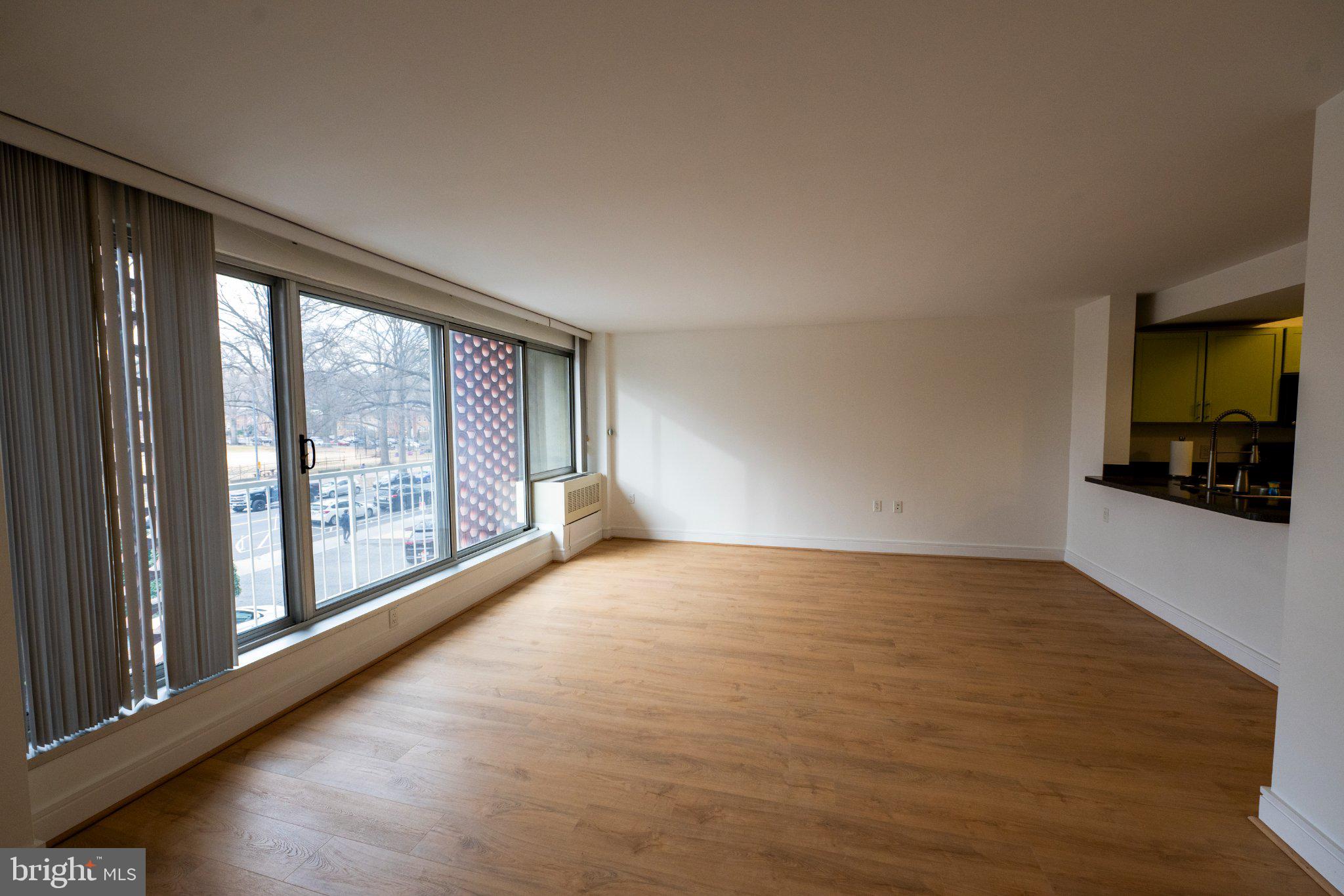 800 4th Street Southwest, Unit N107 Washington, DC 20024 - Photo 11 of 52 Spacious, sunlit living area awaits.