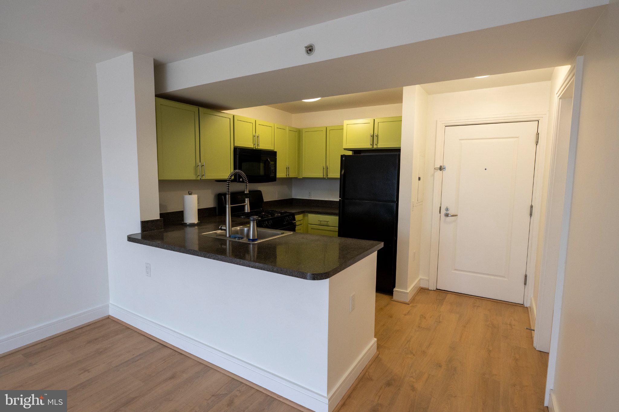 800 4th Street Southwest, Unit N107 Washington, DC 20024 - Photo 13 of 52 Modern kitchen with vibrant accents.