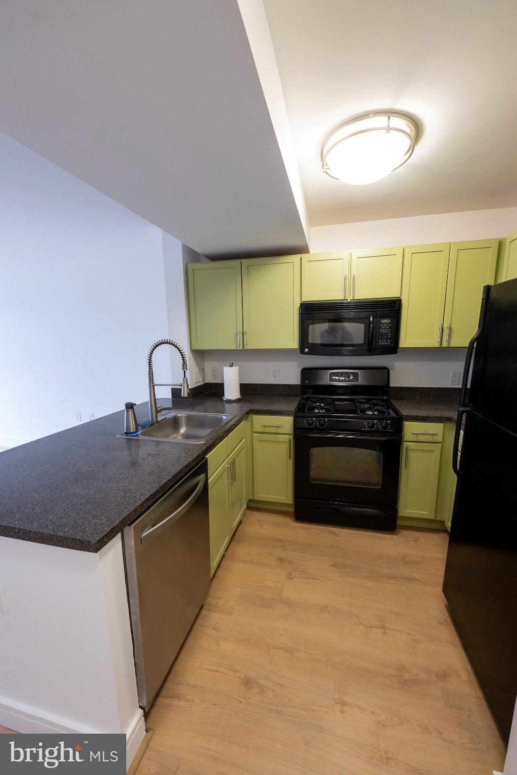 800 4th Street Southwest, Unit N107 Washington, DC 20024 - Photo 14 of 52 Charming kitchen with vibrant cabinetry.