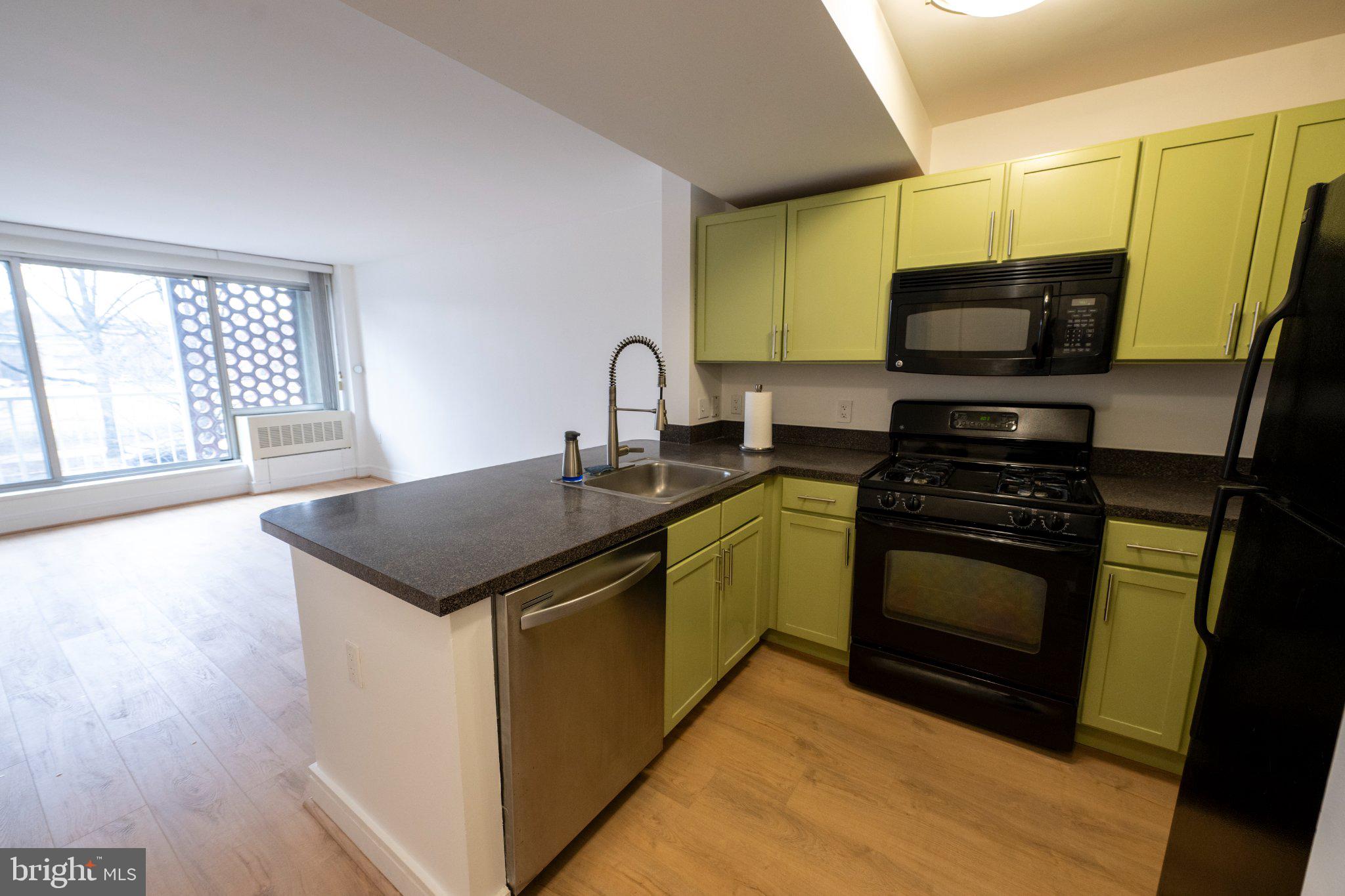 800 4th Street Southwest, Unit N107 Washington, DC 20024 - Photo 15 of 52 Modern kitchen with vibrant accents.