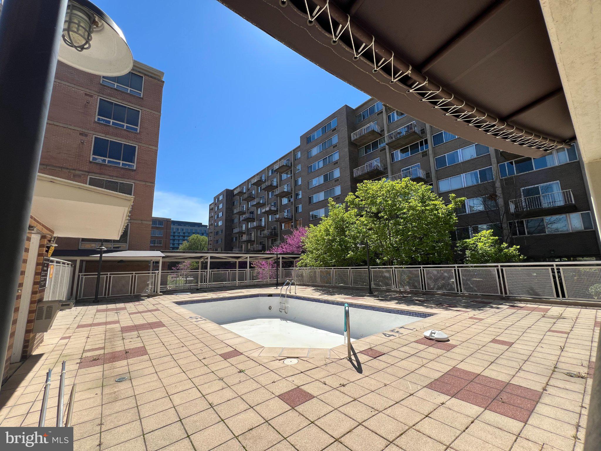 800 4th Street Southwest, Unit N107 Washington, DC 20024 - Photo 52 of 52 Urban oasis with a sunlit pool.