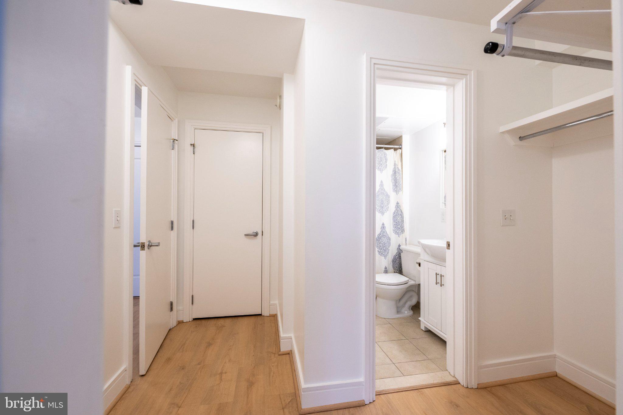 800 4th Street Southwest, Unit N107 Washington, DC 20024 - Photo 8 of 52 Bright and airy hallway leads to bath.