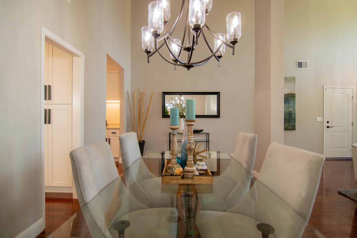 4240 Briarglen Drive San Jose, CA 95118 - Photo 11 of 42 a view of a dining room with furniture a chandelier and wooden floor
