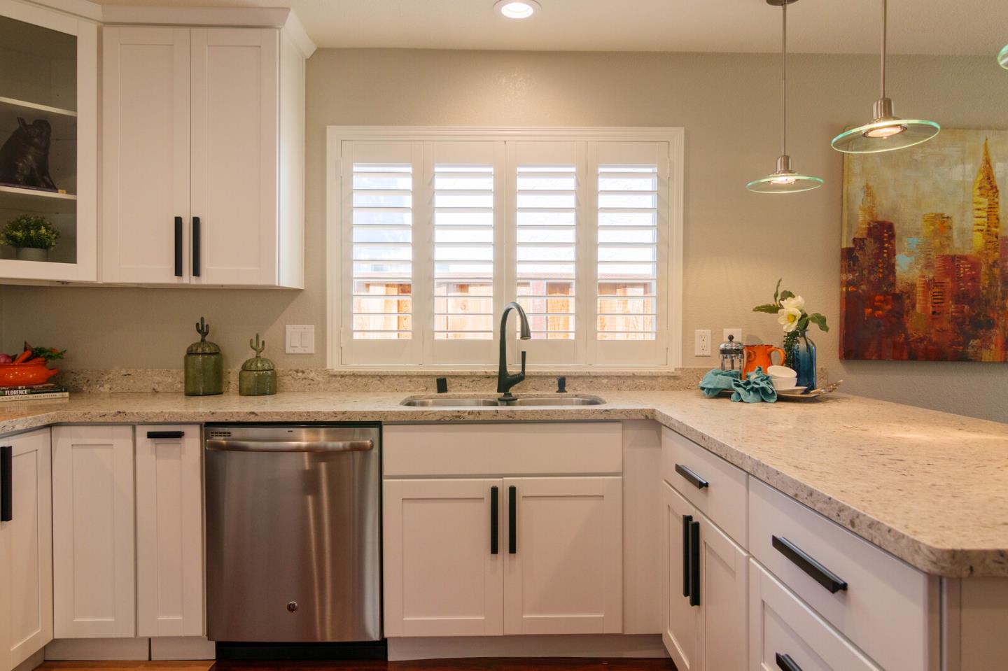 4240 Briarglen Drive San Jose, CA 95118 - Photo 15 of 42 a kitchen with granite countertop a sink white cabinets and white appliances