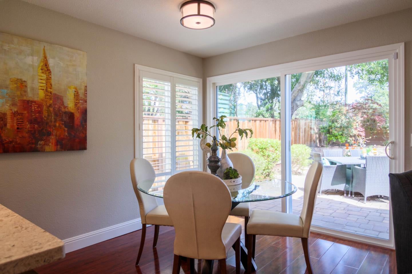 4240 Briarglen Drive San Jose, CA 95118 - Photo 16 of 42 a view of a dining room with furniture window and wooden floor