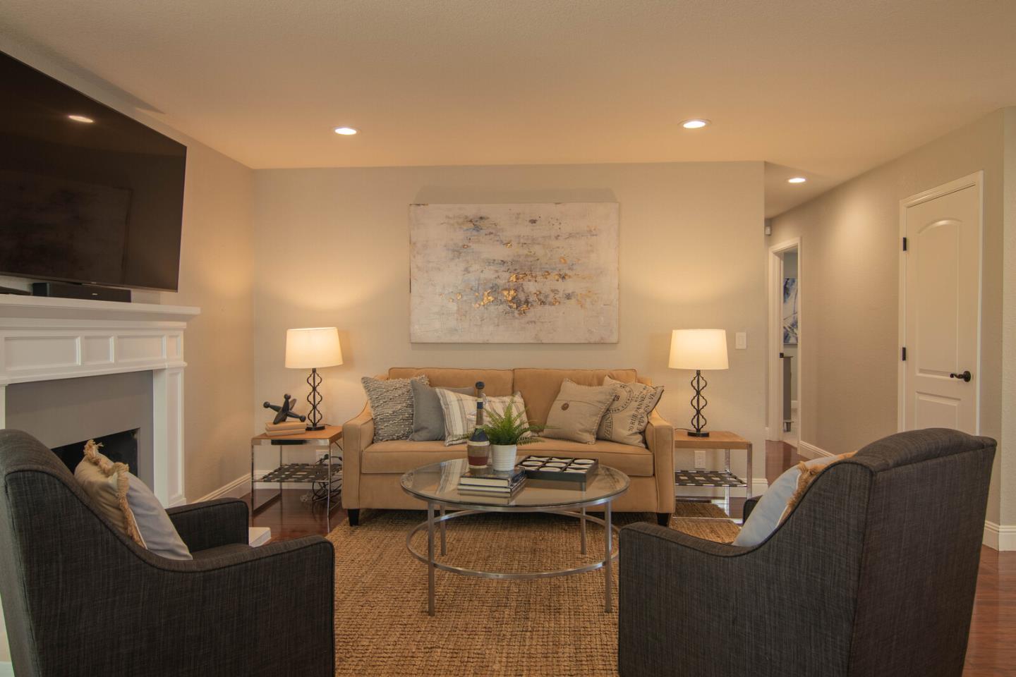 4240 Briarglen Drive San Jose, CA 95118 - Photo 19 of 42 a living room with furniture a flat screen tv and a fireplace