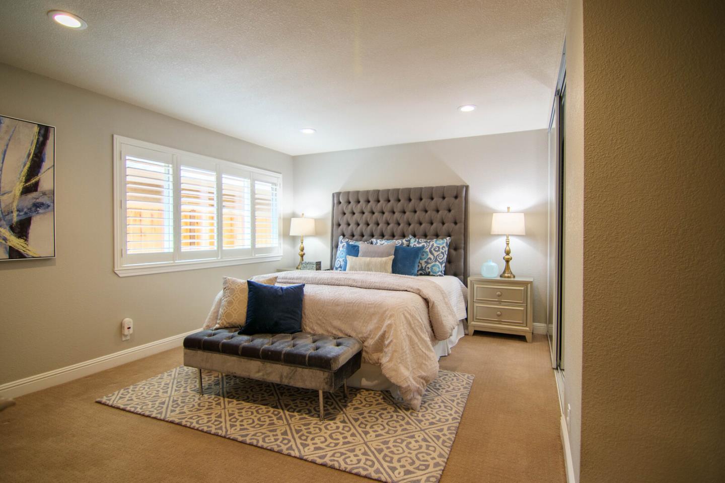 4240 Briarglen Drive San Jose, CA 95118 - Photo 22 of 42 a bedroom with a bed and wooden floor