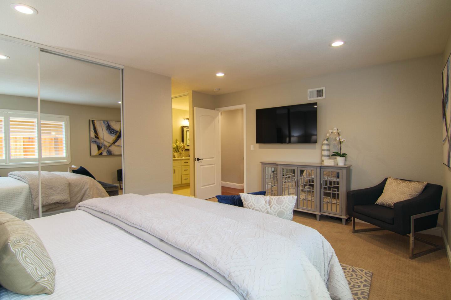 4240 Briarglen Drive San Jose, CA 95118 - Photo 25 of 42 a bedroom with a bed and a flat screen tv