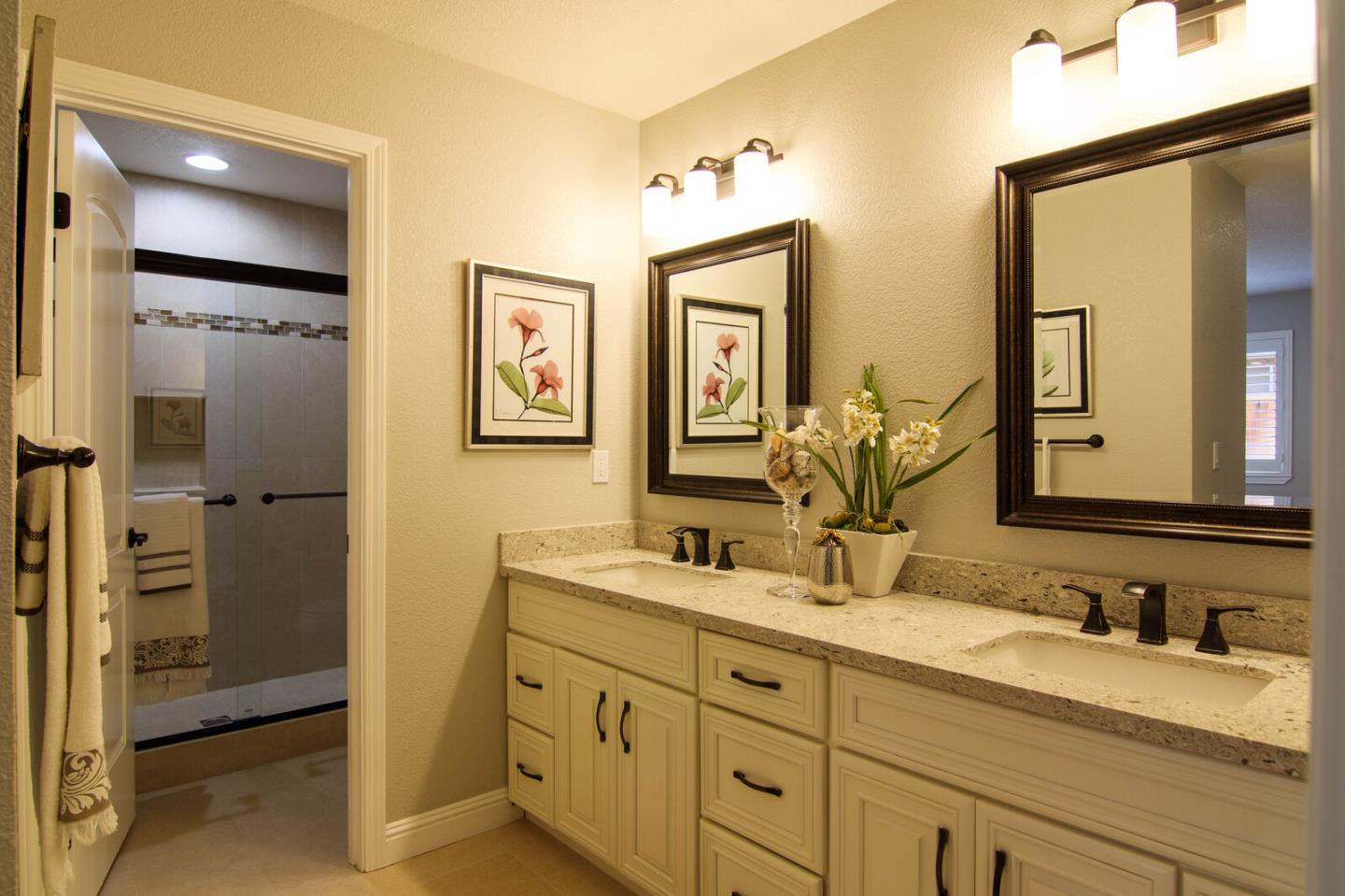 4240 Briarglen Drive San Jose, CA 95118 - Photo 26 of 42 a bathroom with double vanity sink and two mirror