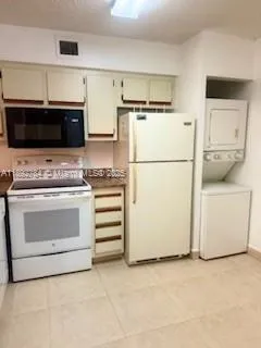 a kitchen with a stove and a refrigerator