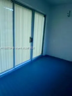 an empty room with wooden floor