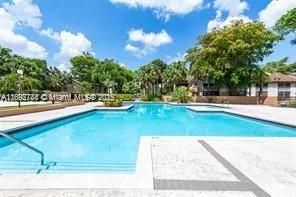 a view of a yard with swimming pool