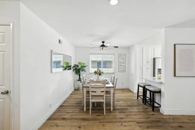 a dining room with furniture and window