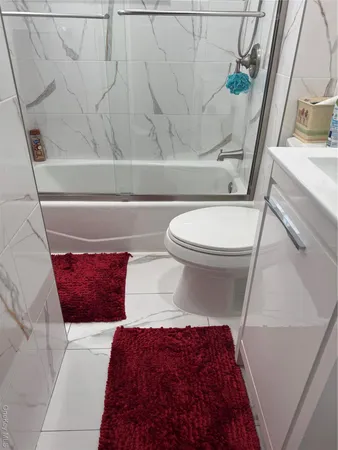 a bathroom with a toilet and a sink