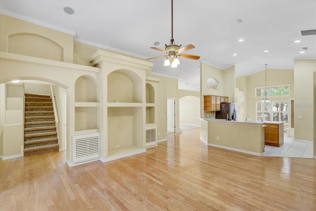 15129 Shearcrest Drive Lithia, FL 33547 - Photo 15 of 48 a view of a living room and kitchen with furniture wooden floor