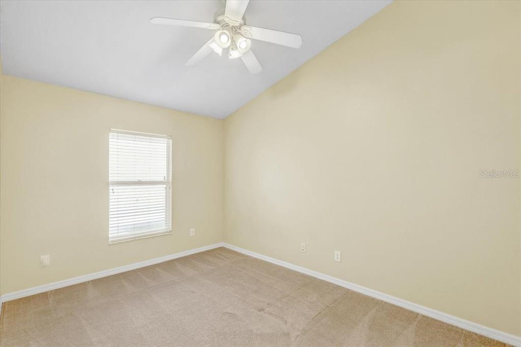 15129 Shearcrest Drive Lithia, FL 33547 - Photo 30 of 48 an empty room with windows and fan