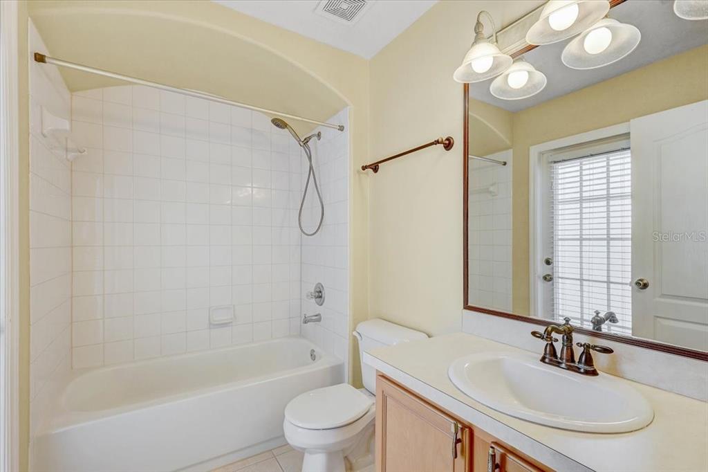 15129 Shearcrest Drive Lithia, FL 33547 - Photo 32 of 48 a bathroom with a sink a toilet and a bathtub