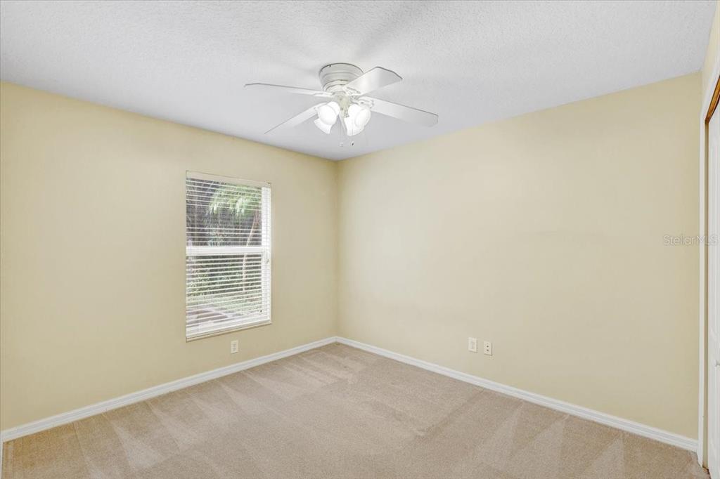 15129 Shearcrest Drive Lithia, FL 33547 - Photo 34 of 48 an empty room with windows and fan
