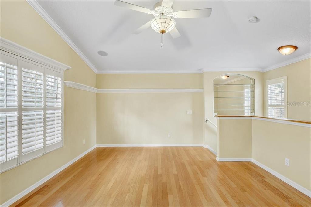 15129 Shearcrest Drive Lithia, FL 33547 - Photo 38 of 48 a view of empty room with wooden floor and fan
