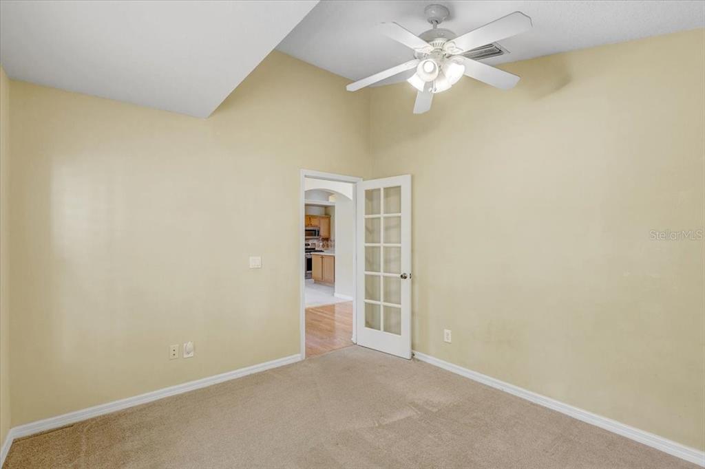 15129 Shearcrest Drive Lithia, FL 33547 - Photo 7 of 48 an empty room with closet and a ceiling fan