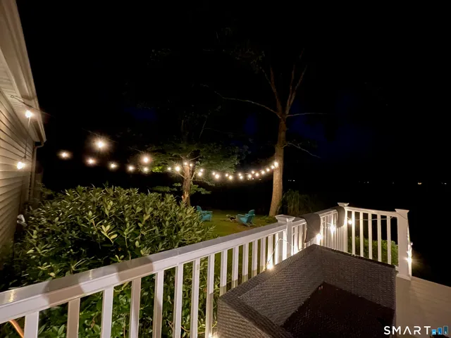 a view of a yard with large trees
