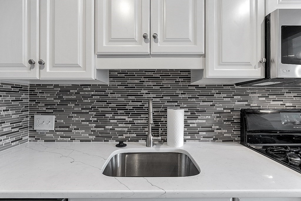 31 Blithewood Avenue, Unit 705 Worcester, MA 01604 - Photo 11 of 31 a kitchen with a sink and a stove