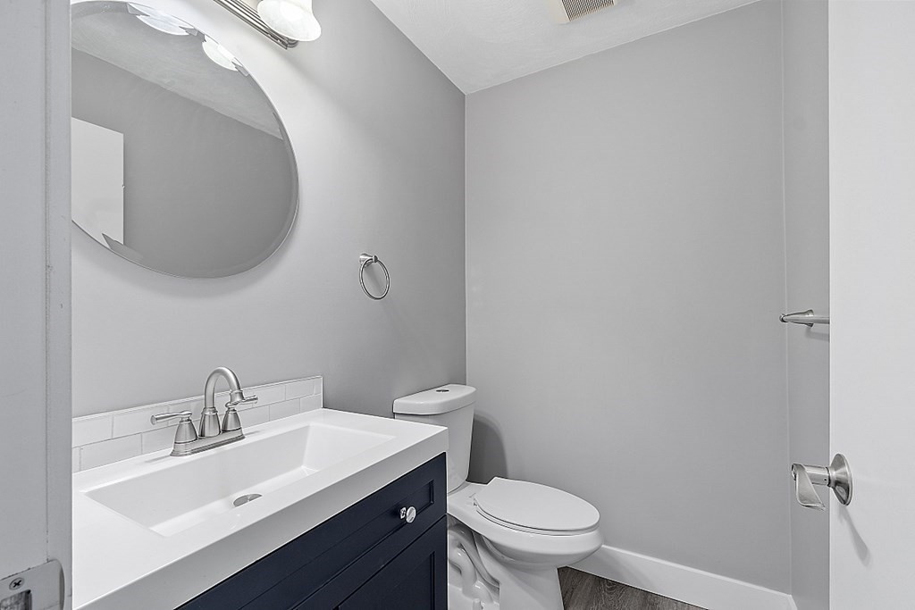 31 Blithewood Avenue, Unit 705 Worcester, MA 01604 - Photo 12 of 31 a bathroom with a sink mirror and toilet