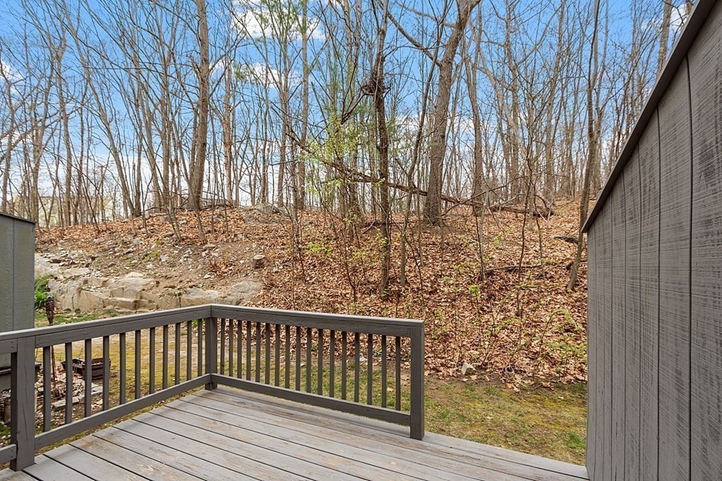 31 Blithewood Avenue, Unit 705 Worcester, MA 01604 - Photo 16 of 31 a balcony with wooden floor and fence