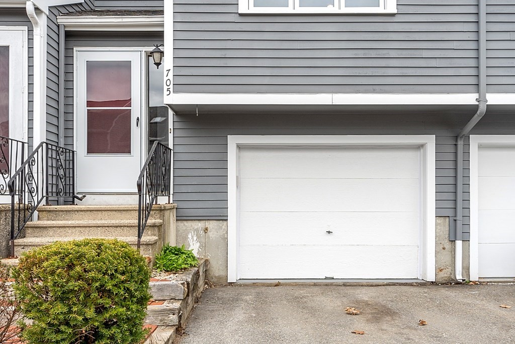 31 Blithewood Avenue, Unit 705 Worcester, MA 01604 - Photo 4 of 31 a front view of a house with a garage